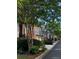 Street view of brick homes with front-facing garages, manicured lawn, and trees at 3025 Woodwalk Se Dr # 17, Atlanta, GA 30339