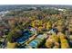 Extensive tennis facilities and club house sit within a vibrant community surrounded by mature trees at 5010 Winding Hills Ln, Woodstock, GA 30189