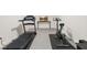 Basement fitness area equipped with a treadmill and stationary bike for convenient workouts at 5010 Winding Hills Ln, Woodstock, GA 30189
