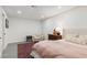 A bedroom area in a finished basement with an area rug, dresser, comfortable chair and closet at 5010 Winding Hills Ln, Woodstock, GA 30189