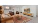 Finished basement with a comfortable seating area and a large decorative rug at 5010 Winding Hills Ln, Woodstock, GA 30189