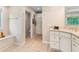 Bright bathroom with double sinks, granite countertops and views leading to a separate toilet room at 5010 Winding Hills Ln, Woodstock, GA 30189