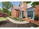 Detailed view of the brick home's entrance, showcasing the blue trim and well-kept landscaping at 5010 Winding Hills Ln, Woodstock, GA 30189
