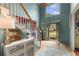 Bright foyer features a staircase, high ceilings, and an open doorway to the outside at 5010 Winding Hills Ln, Woodstock, GA 30189