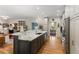 Modern kitchen featuring an island with marble countertops, stainless appliances, and custom cabinetry at 5010 Winding Hills Ln, Woodstock, GA 30189