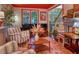 Inviting living room showcasing hardwood floors, piano, fireplace, and comfortable seating at 5010 Winding Hills Ln, Woodstock, GA 30189