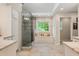Bright and airy main bathroom featuring granite countertops and walk-in shower near a window at 5010 Winding Hills Ln, Woodstock, GA 30189