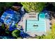Aerial view of the community pool, with a slide and lounge chairs for residents at 5010 Winding Hills Ln, Woodstock, GA 30189