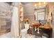 Rustic bathroom featuring wood accents, a unique vessel sink, and a tiled shower with a glass door at 5174 Ridge Tarn, Acworth, GA 30102