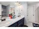Bathroom featuring dual sinks, modern fixtures, and decorative wall accents at 5174 Ridge Tarn, Acworth, GA 30102