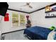 Bedroom with a window, ceiling fan, closet, and view of the neighborhood at 5174 Ridge Tarn, Acworth, GA 30102