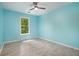 Light and airy bedroom with a ceiling fan, light wood floors, and a serene blue color scheme at 5174 Ridge Tarn, Acworth, GA 30102