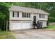 Charming two-story home featuring a two-car garage and welcoming front porch at 5174 Ridge Tarn, Acworth, GA 30102