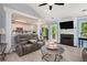 Cozy living room featuring a fireplace, ceiling fan, and comfortable seating at 5174 Ridge Tarn, Acworth, GA 30102
