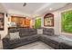 Cozy living room with an open floorplan, a comfortable sectional sofa, and lots of natural light at 5174 Ridge Tarn, Acworth, GA 30102