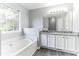 Bathroom featuring granite countertops, double sinks, soaking tub at 5452 Sweetsprings, Powder Springs, GA 30127