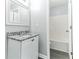 Bathroom featuring a single granite-topped vanity and open access to the shower at 5452 Sweetsprings, Powder Springs, GA 30127