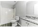 A full bathroom is equipped with a shower, toilet, and a granite countertop vanity at 5452 Sweetsprings, Powder Springs, GA 30127