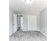 Bedroom features a closet with bi-fold doors, a light, and a window at 5452 Sweetsprings, Powder Springs, GA 30127