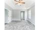 Spacious bedroom with open door leading to an ensuite bathroom and a large window at 5452 Sweetsprings, Powder Springs, GA 30127