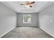 Bedroom features a tray ceiling with ceiling fan and a window at 5452 Sweetsprings, Powder Springs, GA 30127