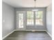 Cozy dining area featuring two windows, glass door and vinyl flooring at 5452 Sweetsprings, Powder Springs, GA 30127