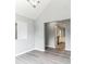 Dining Room area with bright gray walls, wood floors, and pass-through to kitchen at 5452 Sweetsprings, Powder Springs, GA 30127