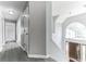 Bright foyer with a soaring ceiling, chandelier and dark wood-look flooring at 5452 Sweetsprings, Powder Springs, GA 30127