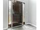 Elegant wooden front door with sidelights, offering a glimpse of the outdoors at 5452 Sweetsprings, Powder Springs, GA 30127