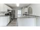 Modern kitchen with white cabinets, stainless steel appliances, and granite countertops at 5452 Sweetsprings, Powder Springs, GA 30127