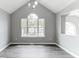 Bright living room featuring hardwood floors, high ceilings, and a large window with neighborhood views at 5452 Sweetsprings, Powder Springs, GA 30127