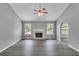 Spacious living room with fireplace, gray walls, and wood-look floors at 5452 Sweetsprings, Powder Springs, GA 30127
