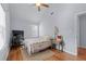 Bedroom featuring vaulted ceiling, ceiling fan, hardwood floors, and a desk area at 732 S Fairfield Dr, Peachtree City, GA 30269