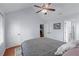 Bedroom featuring vaulted ceiling, ceiling fan, hardwood floors, and closet storage at 732 S Fairfield Dr, Peachtree City, GA 30269