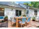Back patio featuring dining table with seating and a shaded umbrella for outdoor living at 732 S Fairfield Dr, Peachtree City, GA 30269