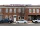 Brick building with a white door and trucks and cars parked out front at 320 Martin Luther King Jr Se Dr # 15, Atlanta, GA 30312