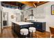 Island kitchen featuring a breakfast bar with modern stools, countertops, and stainless appliances at 320 Martin Luther King Jr Se Dr # 15, Atlanta, GA 30312