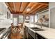 Open concept kitchen with stainless steel farm sink and appliances next to a living space at 320 Martin Luther King Jr Se Dr # 15, Atlanta, GA 30312