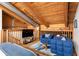 Loft living area featuring wood beams, railing, comfortable seating, TV and natural light at 320 Martin Luther King Jr Se Dr # 15, Atlanta, GA 30312