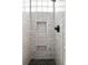 Sleek shower stall features stylish tiling, glass accents and built-in shelves at 320 Martin Luther King Jr Se Dr # 15, Atlanta, GA 30312