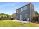 View of the backyard, featuring a lawn, a patio, and privacy fencing at 3406 Pennington Dr, Lithonia, GA 30038