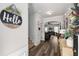 Bright entryway with stylish decor and a view of the living area, featuring hardwood flooring at 3406 Pennington Dr, Lithonia, GA 30038