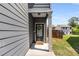 Inviting front entrance featuring gray siding and a charming welcome mat at 3406 Pennington Dr, Lithonia, GA 30038