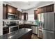 Stylish kitchen featuring stainless steel appliances, granite countertops, and a functional island at 3406 Pennington Dr, Lithonia, GA 30038
