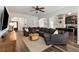 Spacious living room with a large sectional sofa and hardwood floors at 3406 Pennington Dr, Lithonia, GA 30038