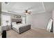 Spacious main bedroom features tray ceiling, large window, and plush carpeting at 3406 Pennington Dr, Lithonia, GA 30038