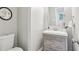 This bathroom features gray walls, a toilet, and a modern vanity with three drawers and a white countertop sink at 410 Dalrymple Ne Rd, Atlanta, GA 30328