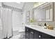 Stylish bathroom with a shower-tub, subway tile, modern fixtures, and sleek vanity at 410 Dalrymple Ne Rd, Atlanta, GA 30328