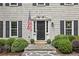 Charming home with wood shake siding, black shutters, and a stone walkway, offering curb appeal at 410 Dalrymple Ne Rd, Atlanta, GA 30328