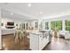 Open-concept kitchen with granite counters, stainless steel appliances, and hardwood floors at 410 Dalrymple Ne Rd, Atlanta, GA 30328